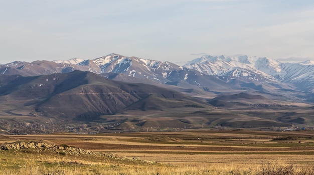 Stunning mountain landscape Snowcovered mountains and yellow valleys Zangezur Mountains Armenia