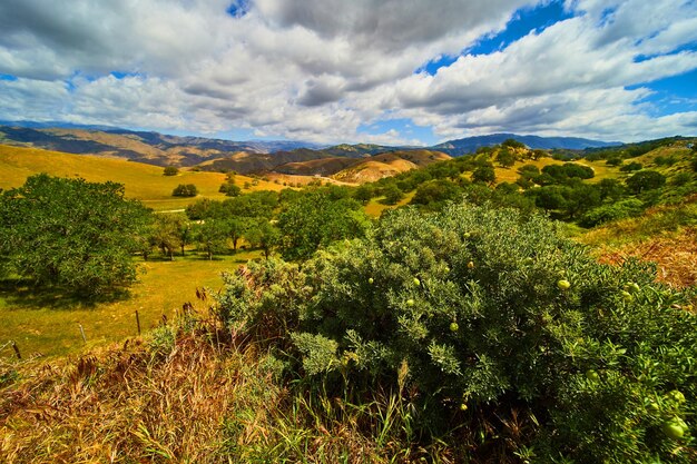 Stunning spring landscape looking over mountains with clouds