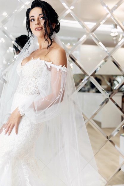 Stunning young bride holding bouquet, portrait
