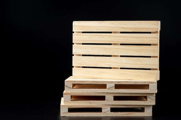 Sturdy wooden pine pallet used in transportation and storage euro pallet epal pallet isolated on black background