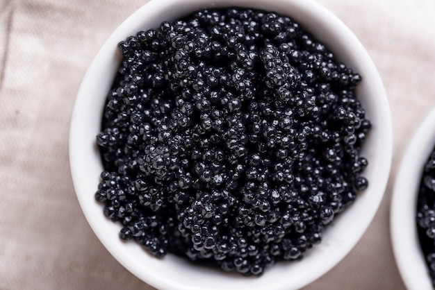 Sturgeon black caviar in bowls