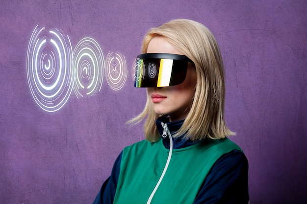 Style blonde woman in 90s clothes and VR glasses