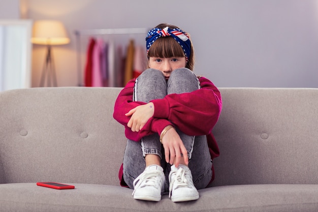 On style. Charming pupil wearing casual clothes while going to visit her friend