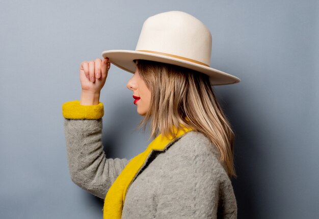 Style woman in coat and hat 