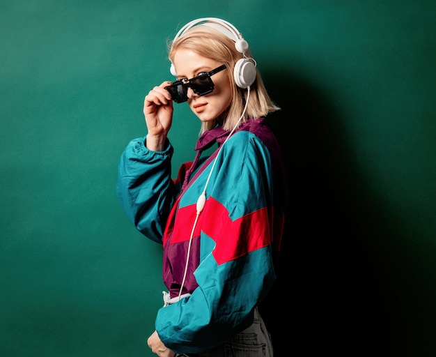 Photo style woman in sunglasses with headphones