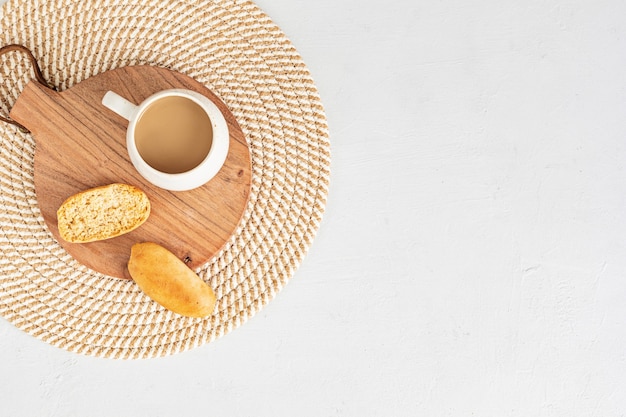 Styled minimal desktop with coffee cup and crackers