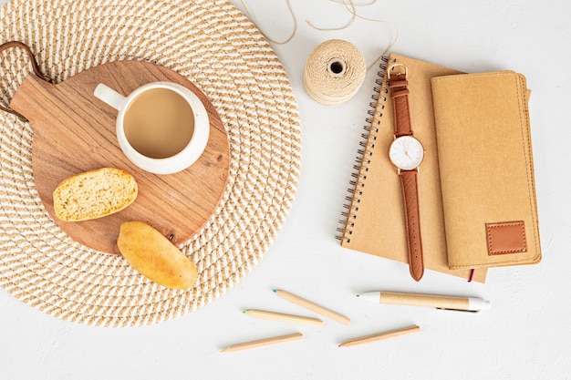 Photo styled minimal desktop with organic color stationary, coffee cup