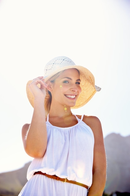 Styled for summer Portrait of a beautiful young woman enjoying a bright summers day outdoors