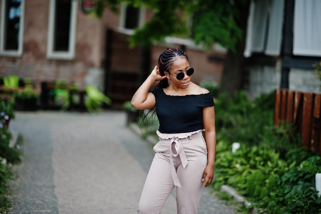 Stylish african american woman at sunglasses posed outdoor