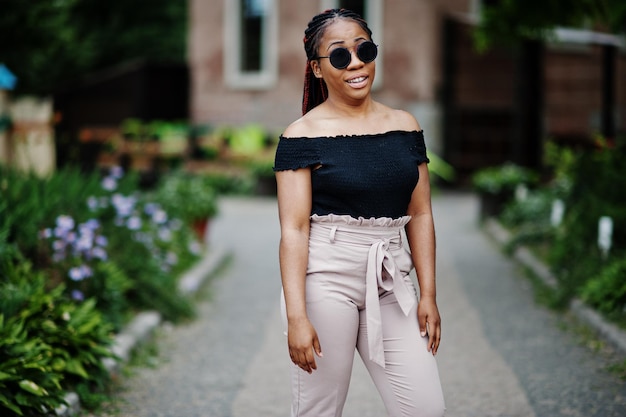 Stylish african american woman at sunglasses posed outdoor