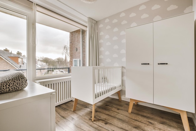 Stylish baby bed and a white wooden