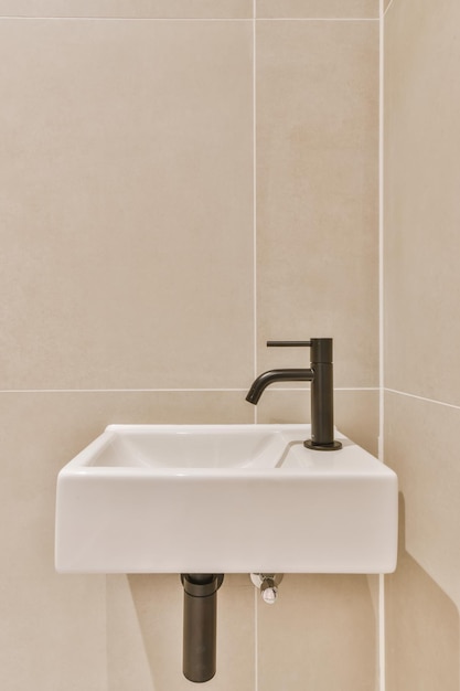 Stylish bathroom in a minimalist style with a small sink