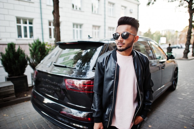 Stylish beard man at black leather jacket and sunglasses