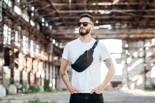 Stylish bearded man with waist bag