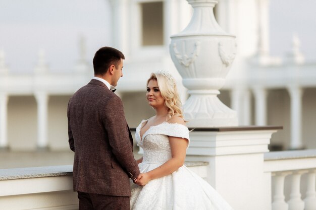 Stylish beautiful happy bride and groom