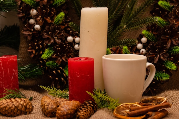 Stylish beautiful New Years composition of cones spruce and candles