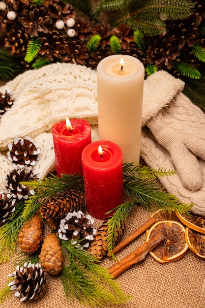 Stylish beautiful New Years composition of cones spruce and candles