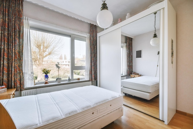 Stylish bedroom with bed and wardrobe