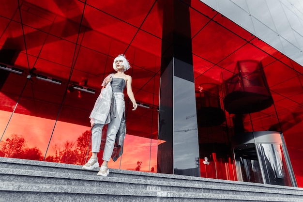 Stylish blonde on a red background