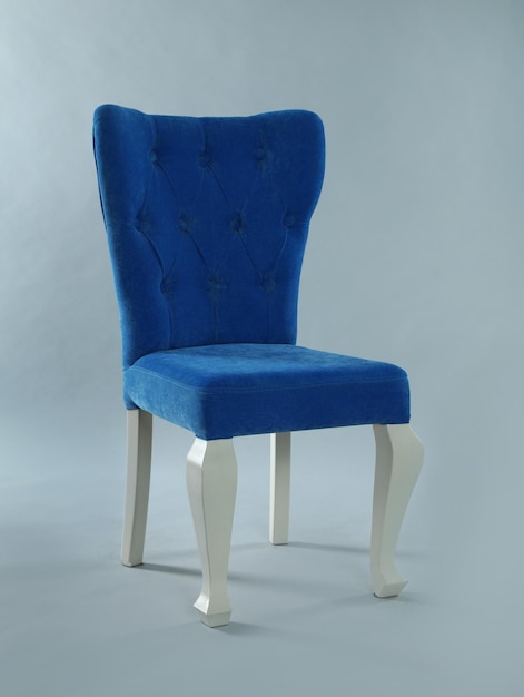 Stylish blue chair on light grey background Element of interior design