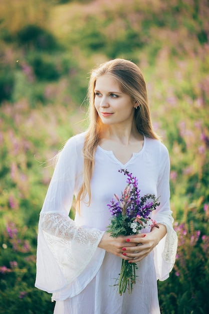 stylish boho girl holding rustic bouquet 