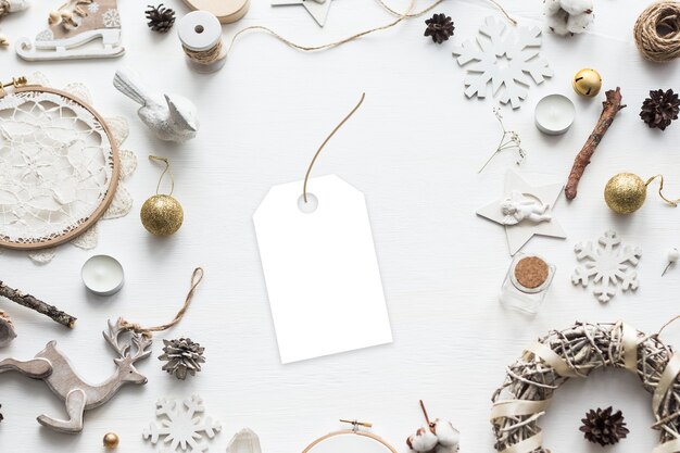 Photo stylish branding mockup to display your artworks. cute vintage christmas new year gifts mock up on wooden background. flat lay top view.