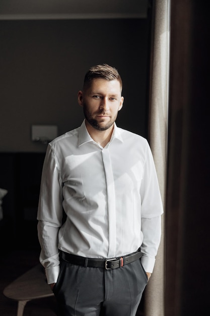 The stylish bridegroom dresses prepares for the wedding ceremony Large portrait