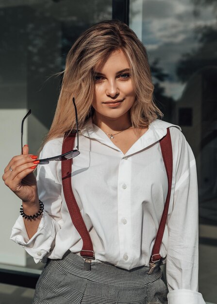 Stylish business woman posing outside