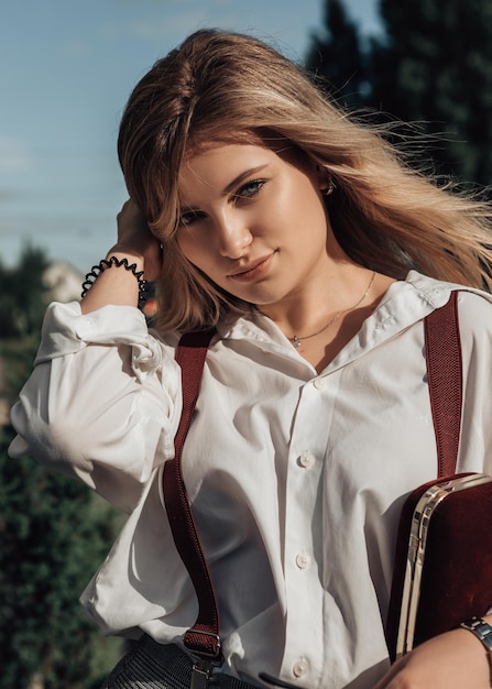 Stylish business woman posing outside