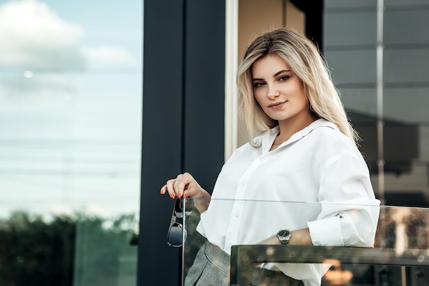 Stylish business woman posing outside