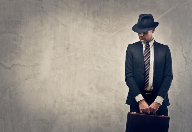 Stylish businessman with a suitcase