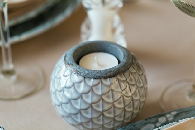 Stylish ceramic round candle stand close up