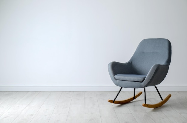 Photo stylish comfortable armchair near light wall indoors