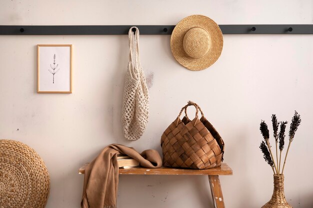 The stylish composition of cosy entryway with wooden bench\
coffee table basket hanger and personal accessories beige wall home\
decor template