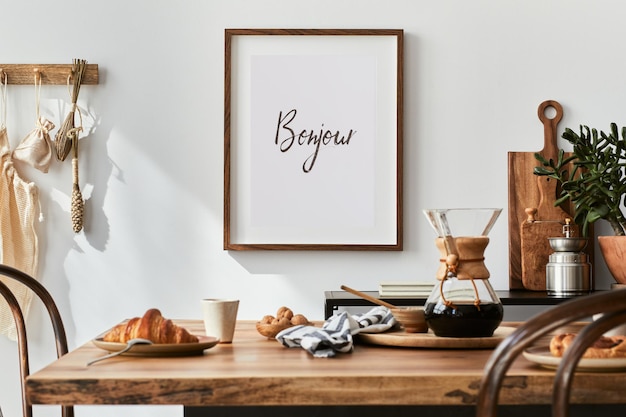 Stylish composition of cozy dining room intrerior with mock up poster frame, wooden family dining table, plants and vintage personal accessories. Copy space. Template. Autumn vibes.