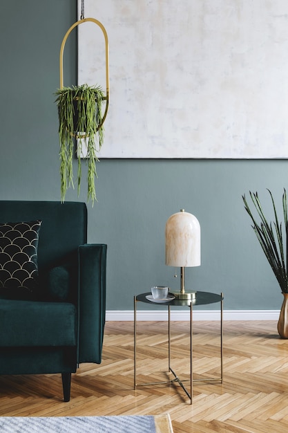 Stylish composition of luxury apartment living room interior with design sofa, coffee table and accessories. Green walls and wooden parquet.