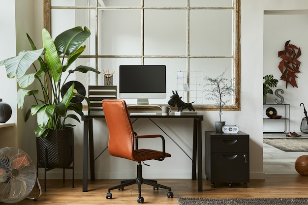 Stylish composition of modern masculine home office workspace\
interior design with black industrial desk, brown leather armchair,\
pc and stylish personal accessories. template.