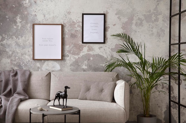 The stylish compostion at living room interior with design gray
sofa coffee table plant hanger lamp and elegant personal
accessories loft and industrial interior moc up poster template
xd