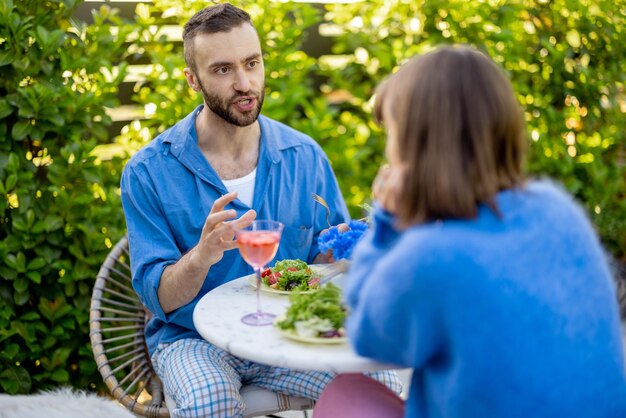 Stylish couple spend romantic evening at backyard