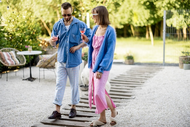 Stylish couple spend summer time at the backyard