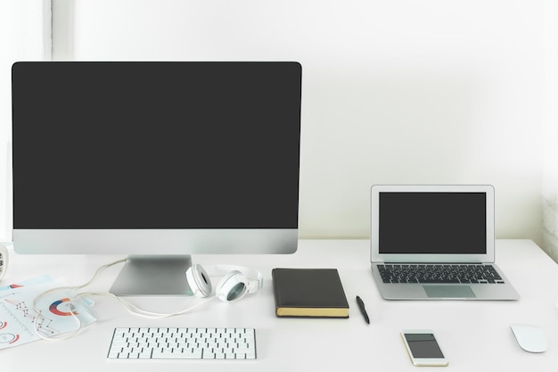 Stylish desk top with empty laptop screen