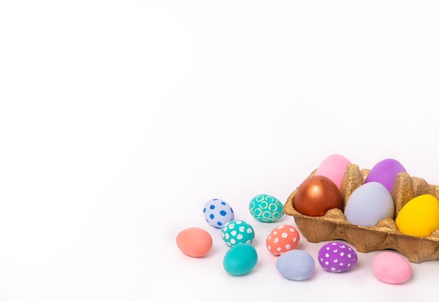 Stylish Easter eggs and on white background Happy Easter Natural dyed colorful eggs in gold tray