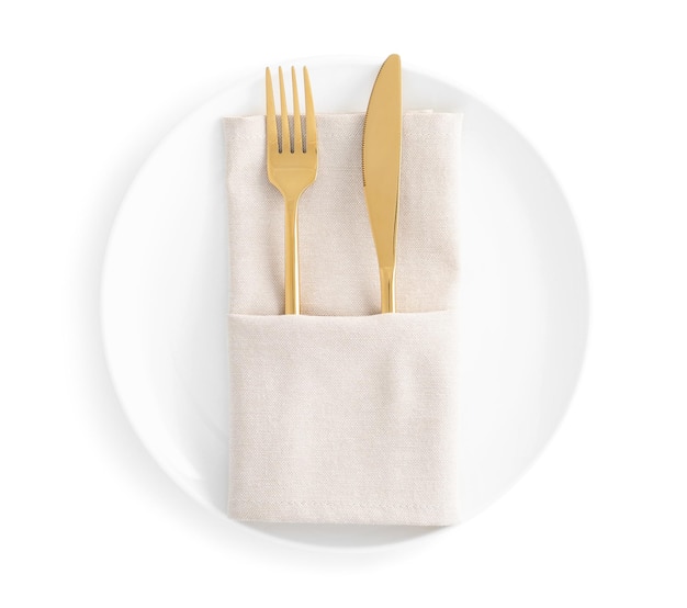 Stylish elegant cutlery with napkin in plate isolated on white top view