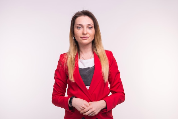 Stylish european business woman in a red jaket on white background