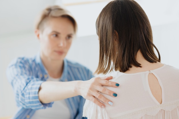 stylish European woman with glasses in a bright room a confident woman is a psychologist