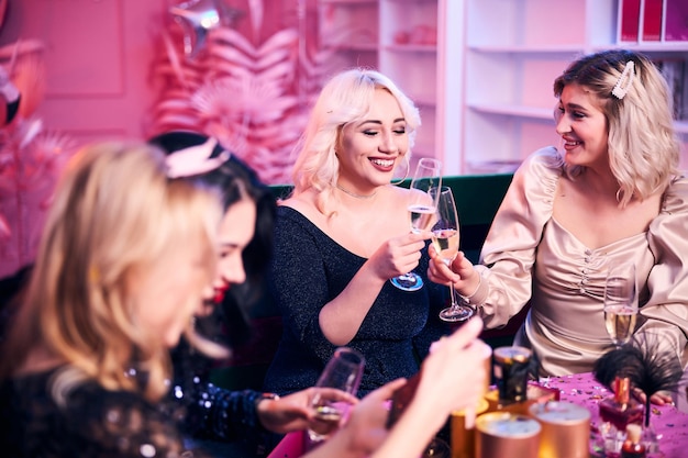 Stylish female colleagues having an office party