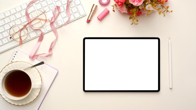 Stylish feminine workspace with tablet white screen mockup and accessories on white background