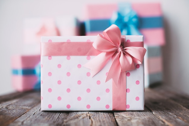 Stylish gift box on a wooden background.