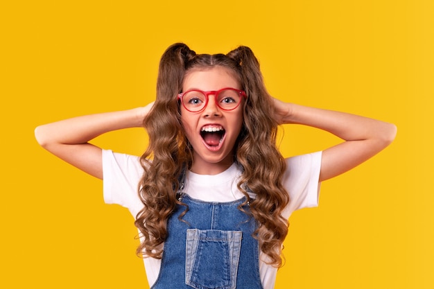 Stylish girl looking at camera and screaming