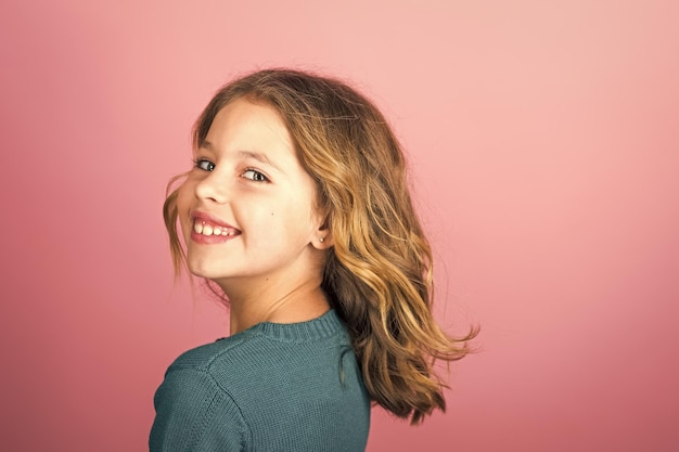 Stylish girl with pretty face on grey background Hairdresser skincare casual style denim Fashion model and beauty look Little girl with long hair Beauty and kid fashion with healthy hair